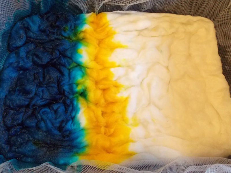 Continue adding dye to the yarn or wool