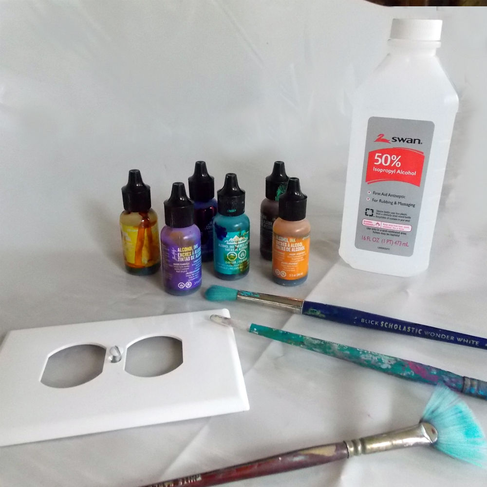 blank outlet covers, Ranger alcohol ink, paint brushes and rubbing alcohol