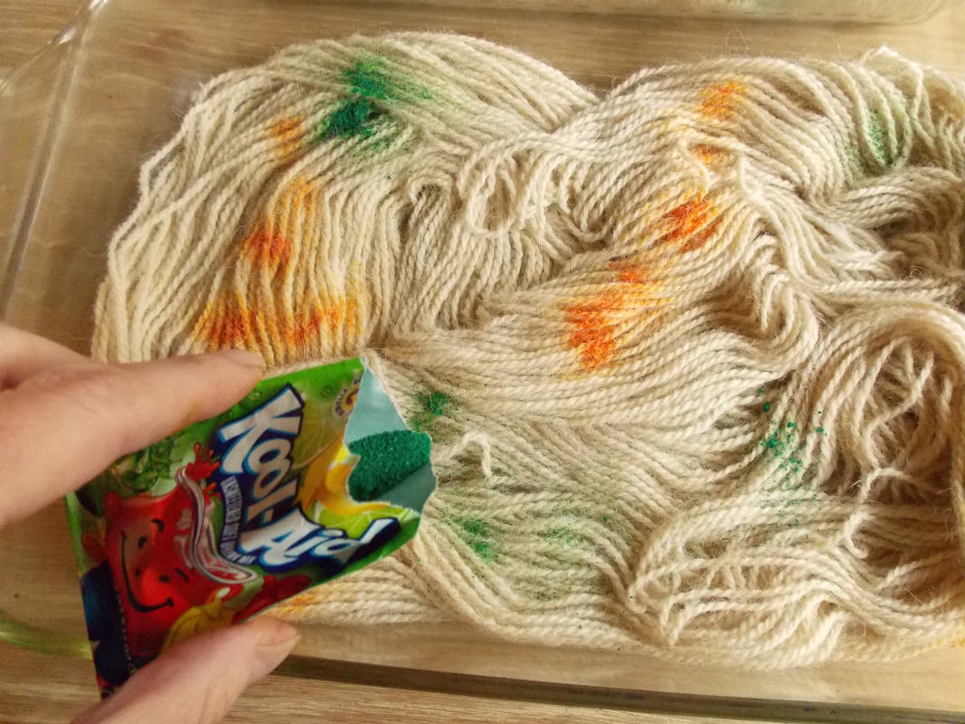 Add more Kool Aid powder dye to the yarn