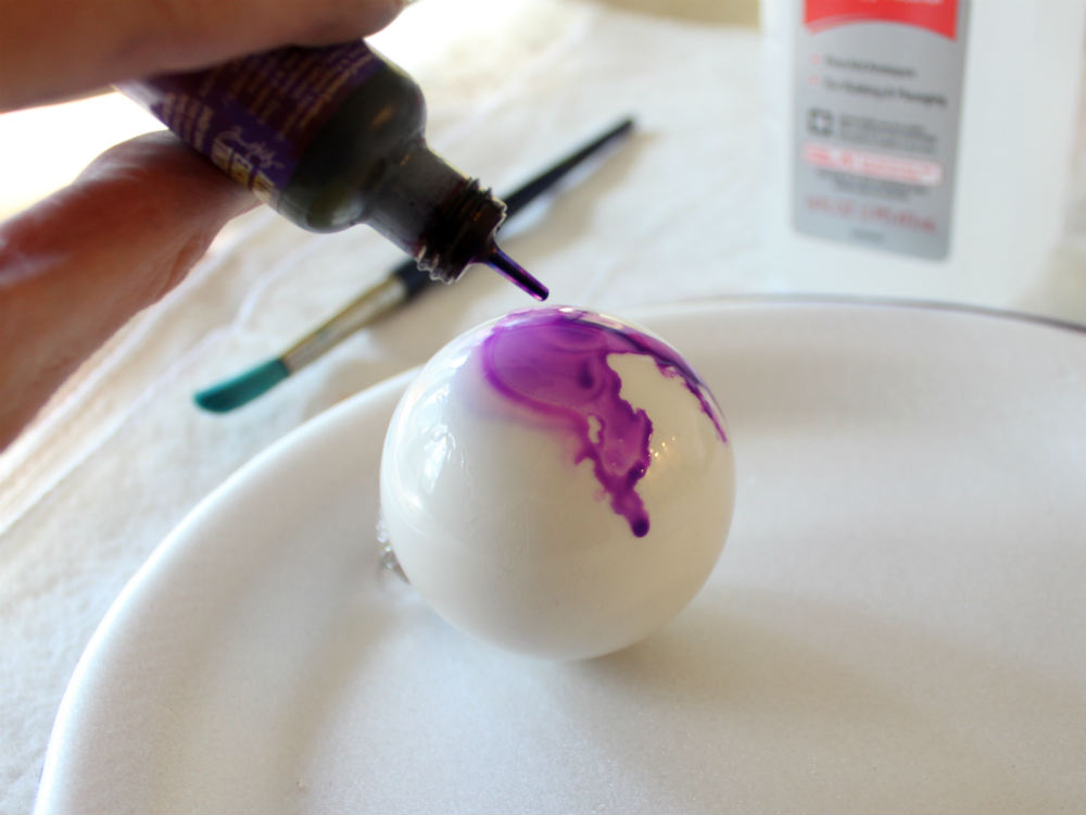 Apply alcohol ink to the glass christmas ornament