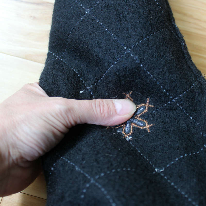 Measure the sweater sleeve a little longer than the wine bottle