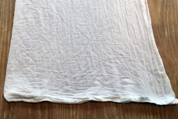Fold the flour sack towel to be dyed like an accordion