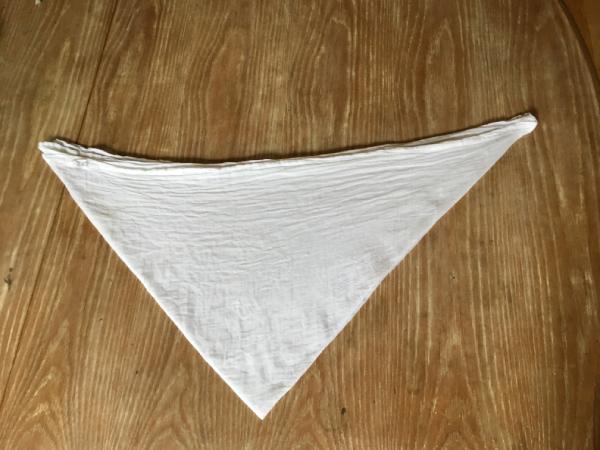 Fold the cotton towel into a triangle