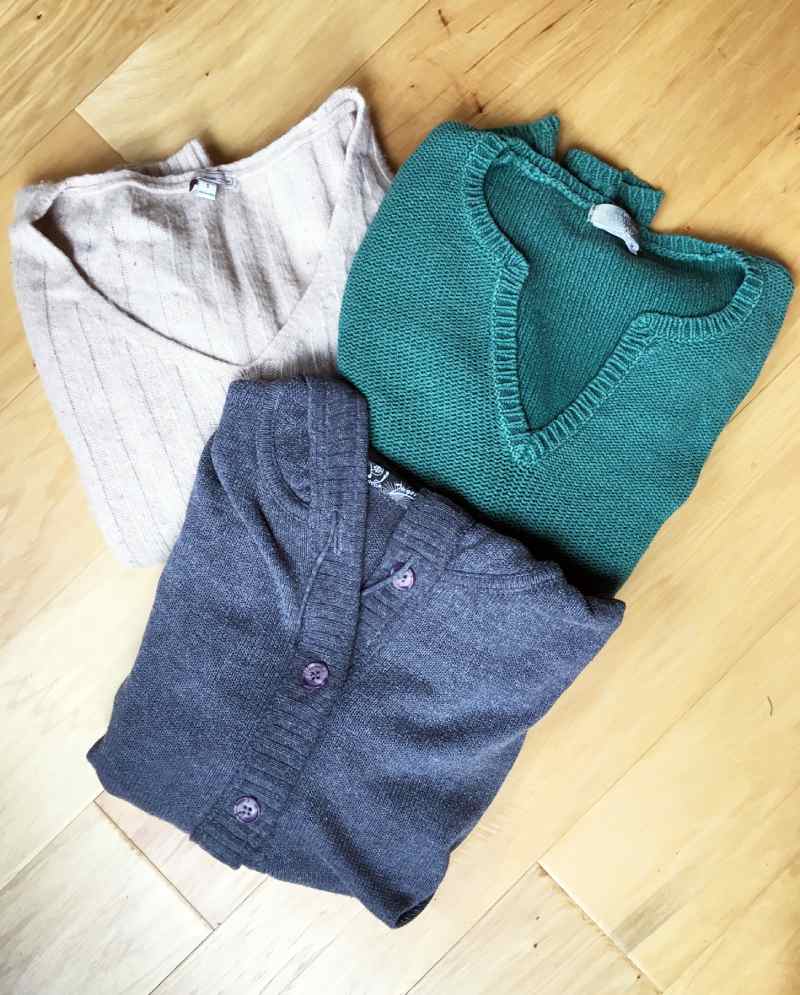 Various old sweaters for sewing into a Christmas Stocking