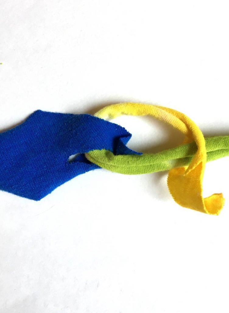 Pulling the tshirt yarn all the way through to connect