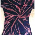 image of a black t shirt with light red spiral dyed stripes