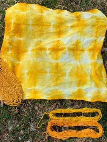 image of fabric and yarn tie dyed with turmeric powder