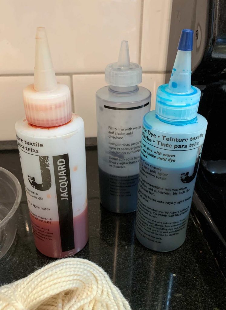 image of three squeeze bottles with dye